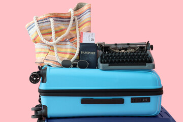 Sticker - Suitcase with vintage typewriter and beach accessories on pink background