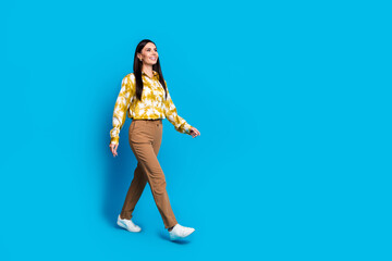 Canvas Print - Photo of adorable lovely woman stylish trendy clothes go look empty space isolated on blue color background