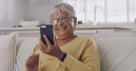 Poster - Senior woman browsing, social media and laughing on phone while relaxing, sitting on couch. Female texting with an online app and watching funny, comedy videos while relaxing in the living room