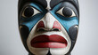 © Clipart Collectors - Traditional Inuit Haida Eskimo folk art of a stylized face mask in textured black, white and red and blue.
