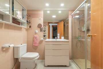 Wall Mural - A conventional bathroom with a flat-floor shower cabin, frameless mirror on the wall and white furniture