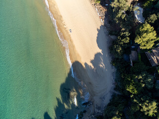 Aerial view on boats, crystal clear blue water of Plage du Debarquement white sandy beach near Cavalaire-sur-Mer and La Croix-Valmer, summer vacation on French Riviera, Var, France