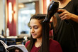 © ProArt Studios - Gorgeous indian young woman getting her hair blow dried at a salon