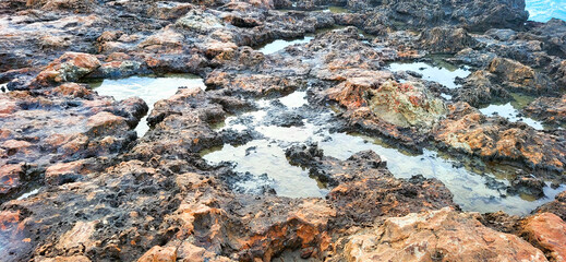 Water in rock on the beach