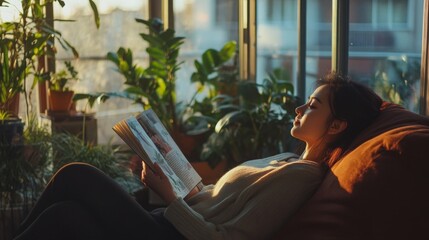 Aufkleber - A woman sits comfortably on a couch, absorbed in a magazine. Sunlight streams through large windows, illuminating the indoor garden filled with various plants, enhancing the tranquil atmosphere.