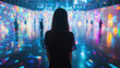 © WETDREAM - A woman stands in front of a large, colorful display