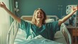 © Johannes - Happy woman patient with arms outstretched on hospital bed celebrating her recovery from surgery.