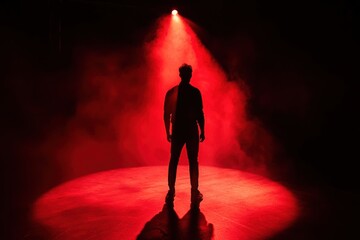 Aufkleber - A mysterious and shadowy figure is highlighted by a single spotlight, creating a suspenseful atmosphere filled with deep red and black hues. Generative AI