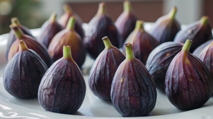 Wall Mural - A plate of purple figs with green stems