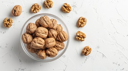 Wall Mural - A bowl of walnuts is on a white background