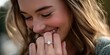 © MDMOHAMMODULAH - Close-up pictures showing off a happy woman flashing her engagement ring. The brilliant diamond ring that is resting on her finger is the main attraction.