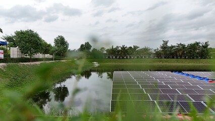 Floating solar panels providing renewable energy. Aerial view floating on solar cells