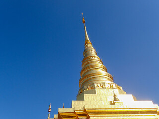 Beautiful temples in Thailand. Awesome view of the golden stupa at Wat Pavaranivesh Vihara Ratchawaraihan in Bangkok, Thailand. The amazing chedi of the Buddhist temple.