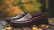© fotogurme - Dark brown loafers with braided leather detail on a rustic wooden surface warm and stylish