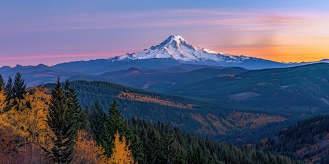 Wall Mural - Warm Sunrise Glow on a Snow-Capped Peak with Autumn Forest Below