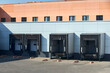 © R_Yosha - Loading dock or loading bay with bumpers, levelers, lift, dock seals or shelters, Loading bay is area of building where goods vehicles road or rail are loaded and unloaded.