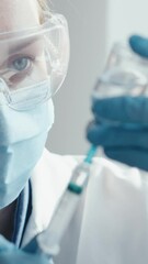 Poster - A medical professional is getting ready to administer a vaccine injection, ensuring the safety and health of the patient. This process involves the use of various precautions and biomedical equipment