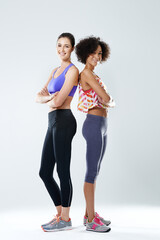 Poster - Fitness, women and portrait with arms crossed in studio for training, teamwork and support in exercise. Happy, friends and athlete with smile by white background for sports, gym and workout together