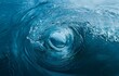 © YiuCheung - A close-up view of a large wave curling in on itself, creating a dark blue circle in the center.