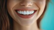 © ardanz - Close-up of a woman smiling, showcasing bright teeth.