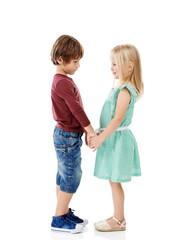 Holding hands, happy and children in studio for love, care and bonding on a white background. Cute, adorable and isolated young boy and girl connection for sibling relation, care and family support