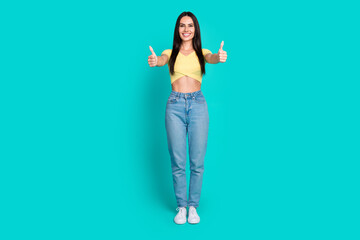 Wall Mural - Full size photo of nice young woman show thumb up wear top isolated on teal color background