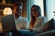 © Atlas Studio - A Couple Enjoying a Cozy Evening Together While Working on a Laptop in a Softly Lit Modern Living Room