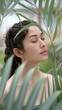 © Kiss - Woman Enjoying Serenity Amidst Lush Greenery with Eyes Closed in Tranquil Setting