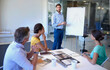 © ArcursForPI/peopleimages.com - Board, coaching or people with leader for presentation, talking or teaching sales ideas in startup. Marginal cost curve, planning or colleagues in meeting discussion for project or training group