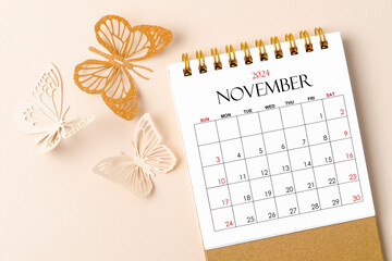 November 2024 desk calendar for the organizer to plan and reminder and butterfly paper.