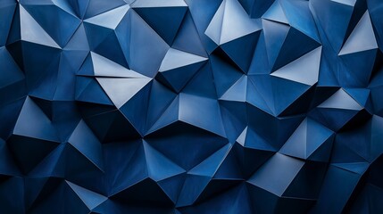 Poster - A blue wall with angular, abstract shapes in shades of grey and navy, resembling folded paper or origami forms