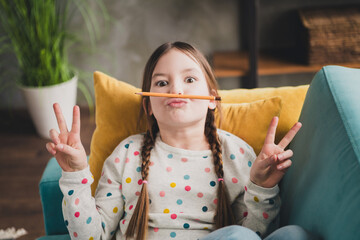 Wall Mural - Portrait of charming little girl pencil mustache v-sign wear pullover modern interior flat indoors