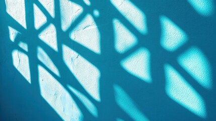 Poster - Shadow overlay of abstract patterns on a pastel blue wall background, adding a creative and artistic flair, shadow pattern of abstract shapes, overlay for editing, artistic shadow effect