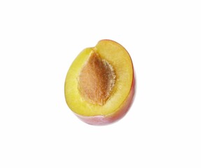 Poster - Half of ripe plum isolated on white