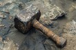 © juliars - Ancient stone hammer with carved handle resting on a rocky ground, concept of ancient crafts and tools