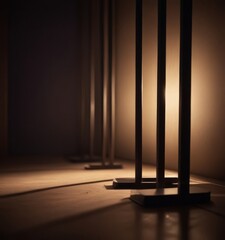 Poster - A dimly lit room with a series of metal poles casting long shadows on the floor, creating a sense of depth and perspective