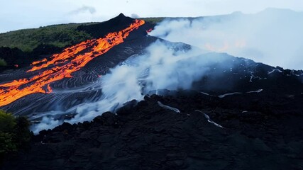 Poster - Red hot lava flowing down the side of a volcano, creating a river of fire and smoke as it makes its way down the mountainside