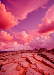 Aufkleber - A breathtaking landscape of rugged, rocky terrain bathed in a soft pink hue, set against a dramatic sky filled with vibrant pink and purple clouds
