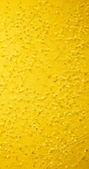 Fototapete - a close-up view textured yellow surface with small white dots or specks scattered across it, creating a pattern of intersecting lines