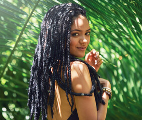 Poster - Girl, portrait and dreadlocks for haircare outdoor with organic shampoo, natural styling and frizz control. Woman, braids and tropical beauty with strong texture, growth wellness and leaf background