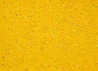 Poster - a close-up view textured surface with a yellow-orange hue, resembling a sandy or pebbled texture