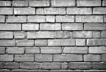 Aufkleber - A monochromatic brick wall, with varying shades of gray and black bricks arranged in a staggered pattern