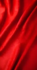 Poster - A close-up view red fabric, with a slight curve and folds, creating a textured and flowing appearance