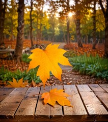 Poster - A vibrant autumn scene unfolds on a wooden table, with a large maple leaf in the foreground and a backdrop of trees and fallen leaves