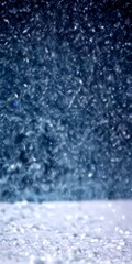 Aufkleber - A close-up view snowy surface with a blurred background of falling snowflakes