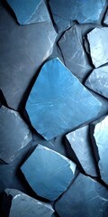 Poster - a close-up view collection of dark gray, jagged stones arranged in a pattern, creating a textured and visually striking composition