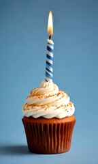 Poster - A single birthday candle illuminates a cupcake with white frosting, sprinkles, and a brown paper liner against a blue background