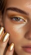 © Business Image - Metallic gold beauty: bold makeup and nails for spring fashion inspiration