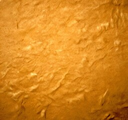 Poster - a close-up view textured beige surface, possibly a piece of paper or fabric, with a slightly crumpled appearance