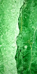 Poster - a close-up view green marble surface with a distinct pattern of cracks and crevices